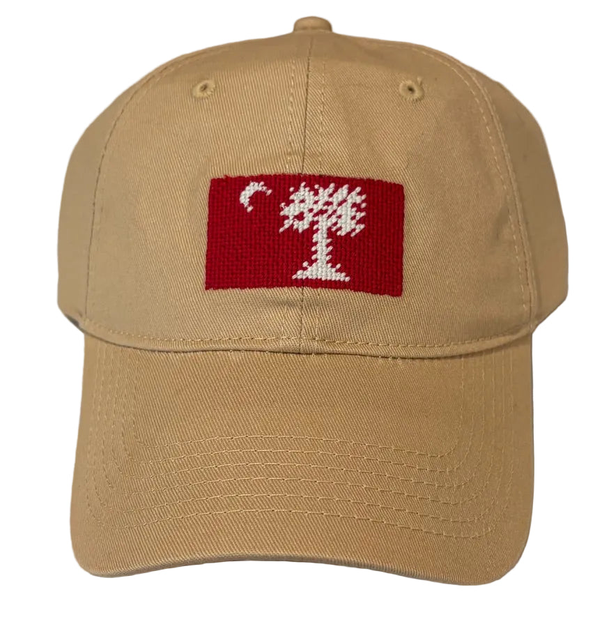 Beige cap with a red and white embroidered big red flag design on a white background