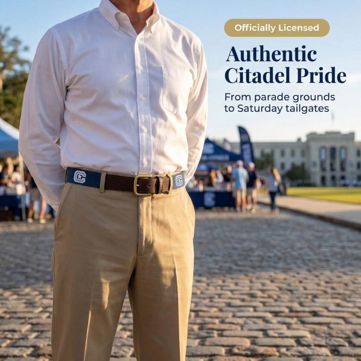 A man wearing a white button-down shirt, khaki trousers, and a brown belt with a visible Citadel badge, standing outdoors on a cobblestone street with promotional text in the upper right.