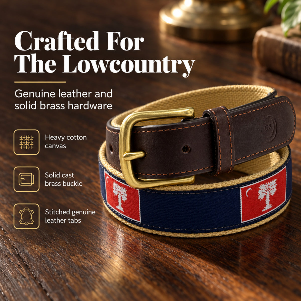 A coiled belt displayed on a wooden surface with marketing text and feature icons. The belt has a dark brown leather strap, a gold-tone brass buckle, and a navy blue canvas section with red panels featuring a white tree motif of The Citadel Big Red flag.