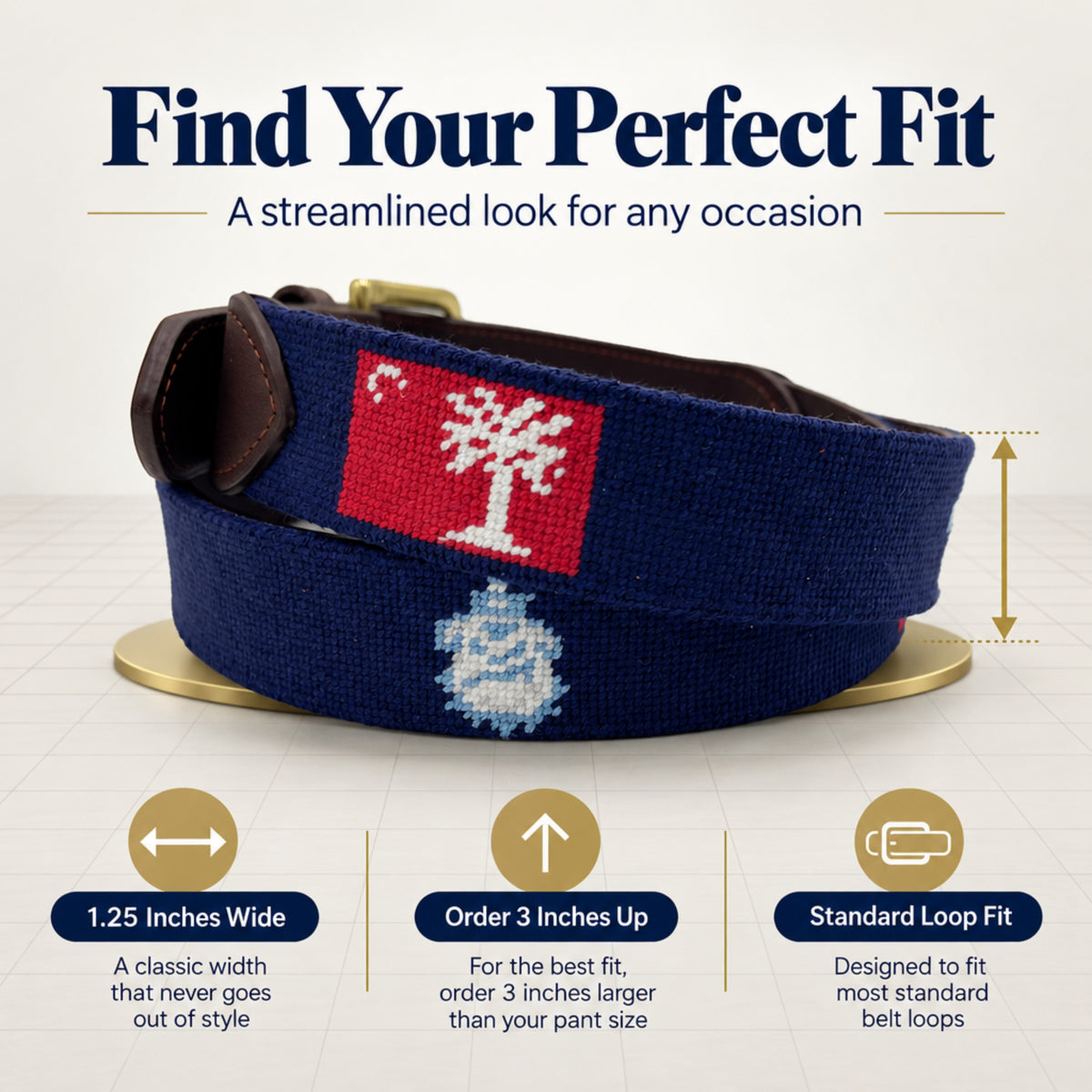 A navy blue needlepoint belt with a red and white big red flag and a white citadel bulldog mascot, shown on a light background with the headline 'Find Your Perfect Fit' and fit-annotation callouts below.